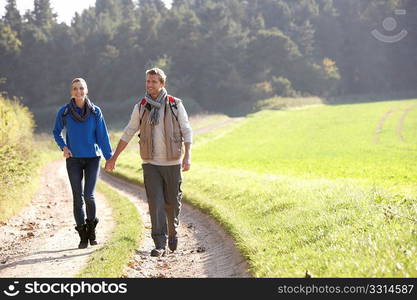 Young couple walking in park