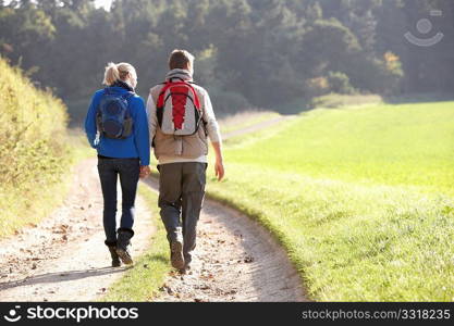 Young couple walking in park