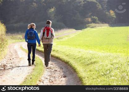 Young couple walking in park