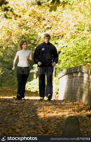 Young couple walking on the road
