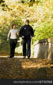 Young couple walking on the road