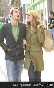 Young couple walking on the road and smiling