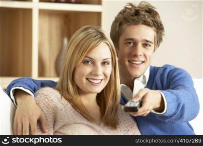 Young Couple Watching Television Together