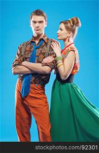 Young couple wearing colorful old-fashion clothes in pinup style. Also they can represent members of a youth counterculture Stilyagi existed from the late 1940s until the early 1960s in the Soviet Union