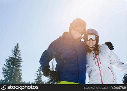 Young couple wearing skiwear