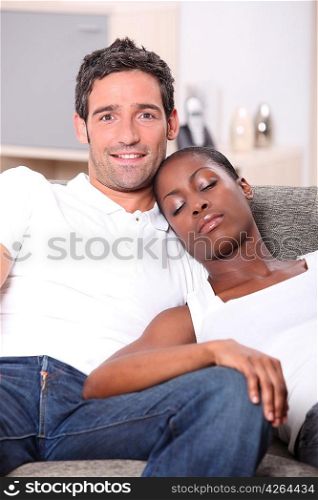 young couple, white man watching us and black woman sleeping on him