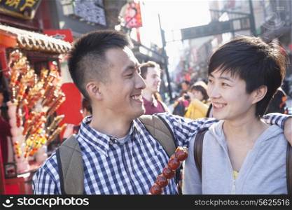 Young couple with candied haw.
