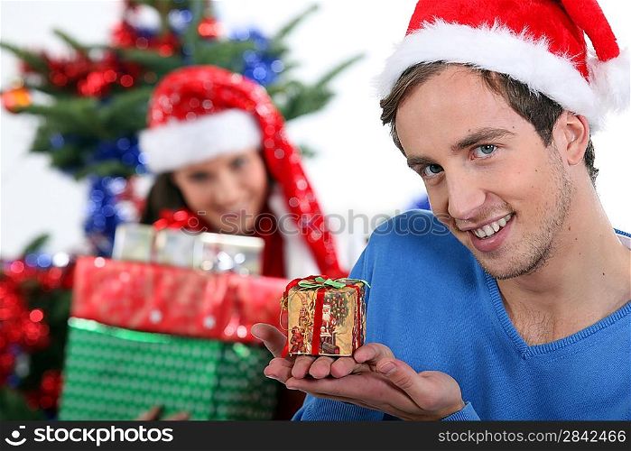 Young couple with Christmas presents