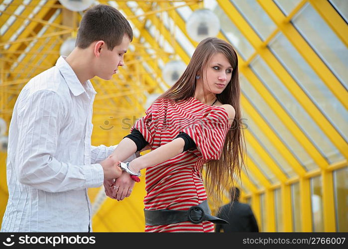 Young couple with handcuffs