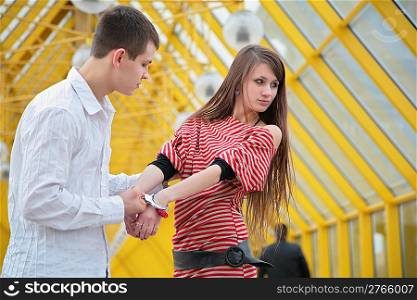 Young couple with handcuffs