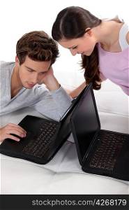 Young couple with laptops