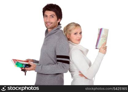 Young couple with maps