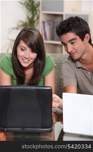 Young couple with their laptop computers