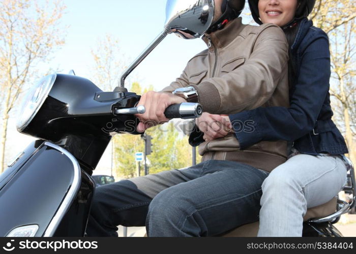 young couple with trendy scooter