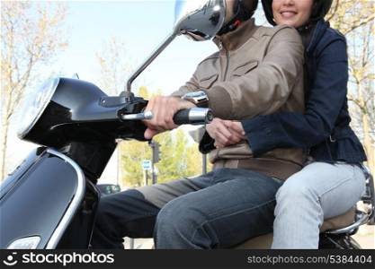 young couple with trendy scooter