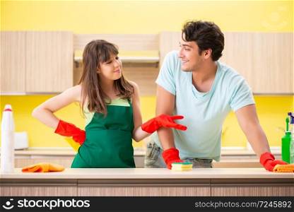 Young couple working at kitchen 