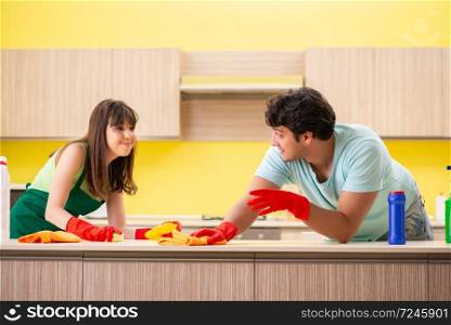 Young couple working at kitchen 