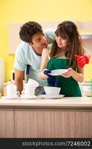 Young couple working at kitchen 