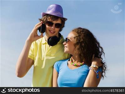 Young couple. Young man and young woman outdoors. Summer vacation