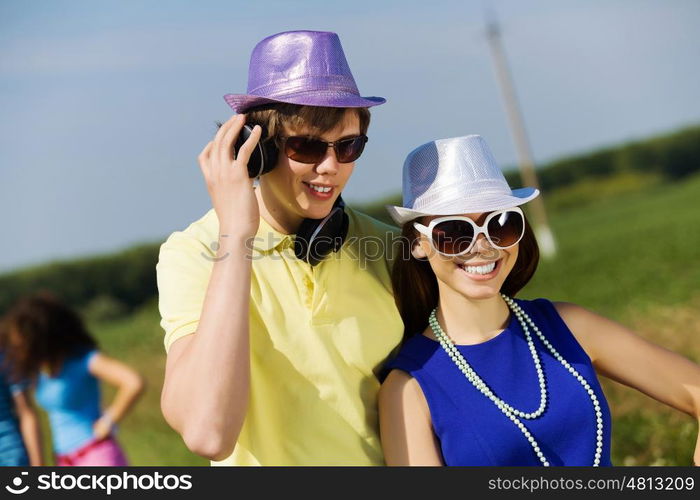 Young couple. Young man and young woman outdoors. Summer vacation