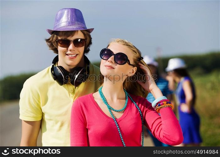 Young couple. Young man and young woman outdoors. Summer vacation