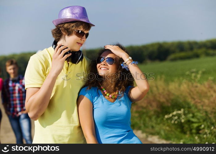 Young couple. Young man and young woman outdoors. Summer vacation