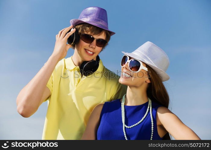 Young couple. Young man and young woman outdoors. Summer vacation