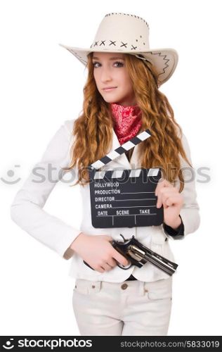 Young cowgirl with gun and movie board isolated on white