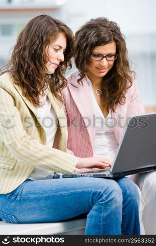 Young creative businesswomen team working on laptop computer at office.