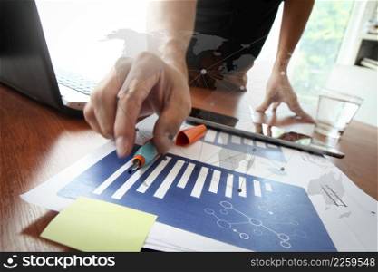 Young creative designer man working at office and social network media and graph chart diagram as concept