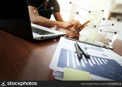 Young creative designer man working at office and social network media and graph chart diagram as concept