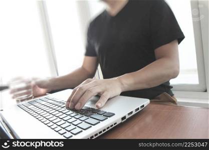 Young creative designer man working at office with computer laptop as concept