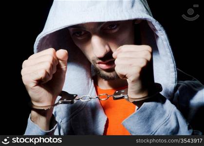 Young criminal with handcuffs