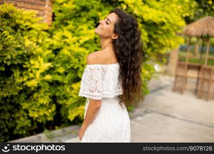 Young curly hair woman in the park