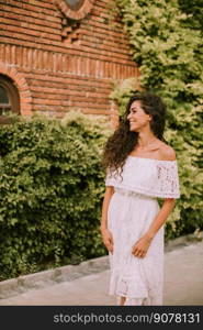 Young curly hair woman in the park