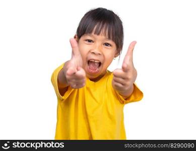 Young cute Asian girl pointing finger forward standing on white background. Cute preschool child looking at camera pointing finger at copy space. indoor studio shot