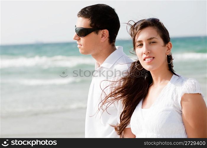 young Cute Couple walk on the beach, Focus On Female