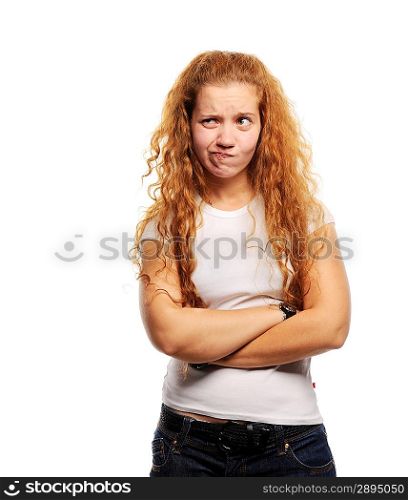 Young cute ginger standing with hands crossed and thinking