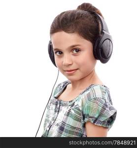 Young cute girl listening something on headphones