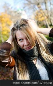 Young cute girl with long dark hairs. Fall. Autumn. Outdoor session.
