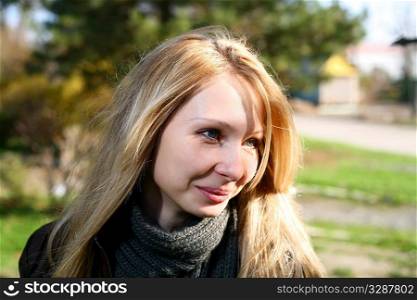Young cute girl with long dark hairs with smile. Fall. Autumn. Outdoor session.