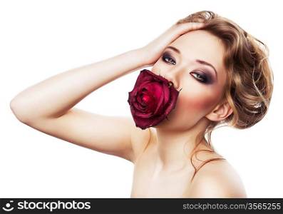 young cute woman and rose in mouth on white background