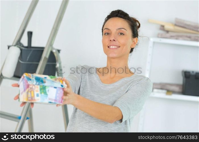 young cute woman holding bank notes