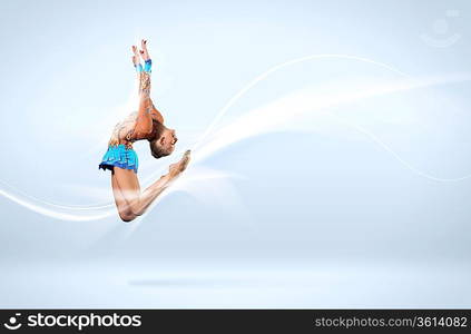 Young cute woman in gymnast suit show athletic skill on white background