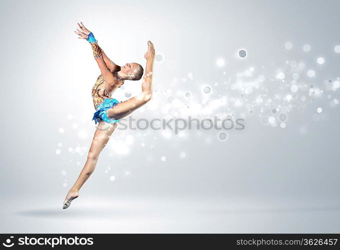 Young cute woman in gymnast suit show athletic skill on white background