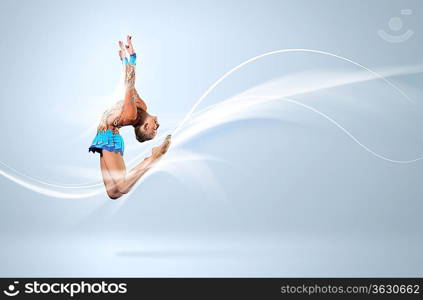 Young cute woman in gymnast suit show athletic skill on white background