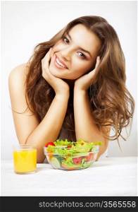young cute woman with juice and salad