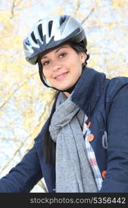 Young cyclist wearing a helmet