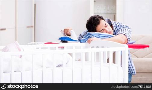 Young dad looking after newborn baby. The young dad looking after newborn baby