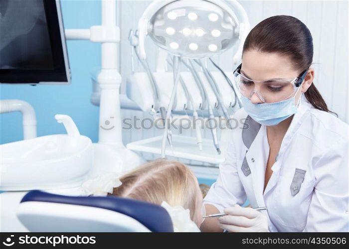 Young dentist at work in the office